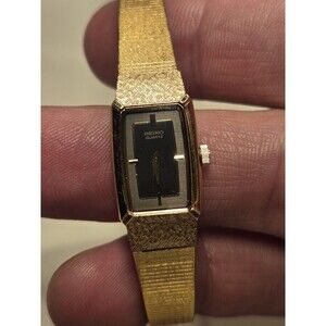 Seiko Tank Watch Women 13mm Black Dial gold Tone Rectangle 2E20-5689 New Battery